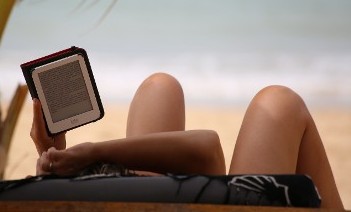 Someone Using a Tablet on the Beach